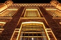 Illuminated old factory building at night in Lodz, Poland Royalty Free Stock Photo