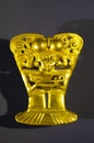 Golden indigenous ornament