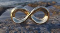 Golden infinity symbol on stone. Eternity sign outdoors. AI Generated Royalty Free Stock Photo