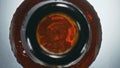 Golden ipa splashing flask top view. Closeup inebriant liquid bubbling in bottle Royalty Free Stock Photo