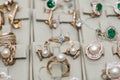 Golden jewellery with pearls and gemstones at showcase