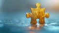 Golden jigsaw puzzle piece on a shiny blue surface. Royalty Free Stock Photo