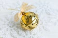 Golden jingle bell Christmas bauble on white