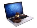 Golden judge gavel on laptop