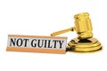 Golden judge gavel and not guilty banner Royalty Free Stock Photo