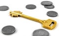 Golden key and coins Royalty Free Stock Photo