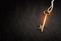 Golden key with glowing lights and dark background, wisdom, wealth, and spiritual concept Royalty Free Stock Photo