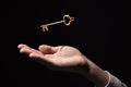 Golden key in hand, the key to success and wealth, new opportunities and good luck in business Royalty Free Stock Photo