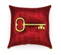 Golden key on royal red velvet pillow isolated on white background 3 Royalty Free Stock Photo