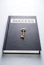 Golden key on success book Royalty Free Stock Photo