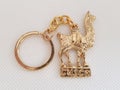 Golden keychain of a llama from Cusco