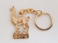 A peruvian golden keychain of a llama