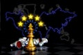 Golden king chess with chess pieces lying on board with illustration yellow stars on world map , business strategy world wild Royalty Free Stock Photo