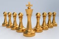 Golden King with golden pawns - chess teamwork concept Royalty Free Stock Photo