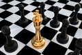 Golden King surrounded by black pawns - chess trap concept Royalty Free Stock Photo