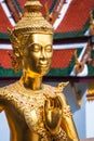 Golden Kinnari statue at Temple of Emerald Buddha (Wat Phra Kaew) in Grand Royal Palace. Bangkok, Thailand Royalty Free Stock Photo