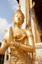 Golden Kinnari statue at Temple of Emerald Buddha (Wat Phra Kaew) in Grand Royal Palace. Kinnari is