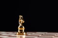 Golden knight chess figure on chessboard Royalty Free Stock Photo