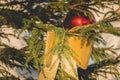 Golden knot hanging on a Christmas tree Royalty Free Stock Photo