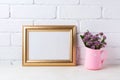 Golden landscape frame mockup with purple flowers in pink rusti