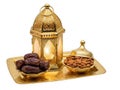Golden Lantern with Dates and Almonds on Decorative Tray Royalty Free Stock Photo