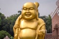 Sculpture of Golden laughing Buddha Buddhist monastery at Sarnath, Varanasi