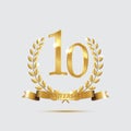 Golden laurel wreaths with ribbons and tenth anniversary year symbol on light background. 10 anniversary golden symbol