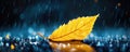 Golden leaf in rainfall on wet pavement with bokeh background Royalty Free Stock Photo