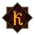 Golden letter K with a royal crown and a floral pattern in a black square