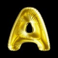 Golden letter A made of inflatable balloon isolated on black background.