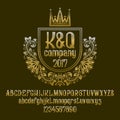 Golden letters and numbers with initial emblem in coat of arms form with crown. Awesome font and elements kit Royalty Free Stock Photo
