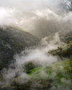 Golden light of autumn dawn dispels the fog and reveals the landscape