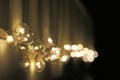 Golden light bulbs on the night dark background. City lights. Bokeh soft abstract background. Bokeh - Image Royalty Free Stock Photo
