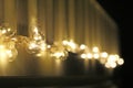 Golden light bulbs on the night dark background. City lights. Bokeh soft abstract background. Bokeh - Image Royalty Free Stock Photo