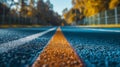 Golden light casts a warm glow over the empty track, creating a peaceful atmosphere perfect for evening workouts Royalty Free Stock Photo