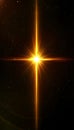 Golden light flare effect with cross shape illuminating cosmic darkness and starburst patterns. Royalty Free Stock Photo