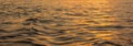 Golden light reflection on river wave ripples surface. Abstract, tranquility,romance,hope