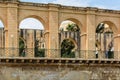 Golden limestone arches of side terrace of Upper Barrakka Gardens in Valletta in Malta