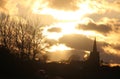 Golden linings clouds sunset with silhouettes Royalty Free Stock Photo