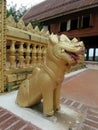 Golden lion guarding Khong Chiam temple