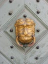 Golden lion head door knocker in Krakow, Poland Royalty Free Stock Photo