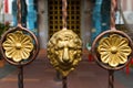 Golden lion head on metal fence decorating at Sri veeramakaliamman temple, Singapore