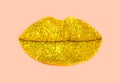 Golden lips of glitter on pastel pink background