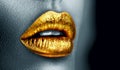 Golden lipstick closeup. Metal gold lips. Beautiful makeup. Sexy lips, bright paint on beautiful model girl`s mouth, close-up Royalty Free Stock Photo