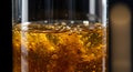 Golden liquid bubbling in a clear glass vessel Royalty Free Stock Photo