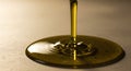 Golden liquid pouring on plate closeup Royalty Free Stock Photo