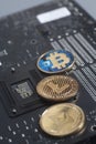 Golden Litecoin,Bitcoin,Ethereum on motherboard digital cryptocu