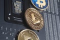 Golden Litecoin,Bitcoin,Ethereum on motherboard digital cryptocurrency. Mining concept Royalty Free Stock Photo