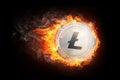 Golden Litecoin coin flying in fire flame.