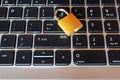 Golden locked padlock on laptop keyboard Royalty Free Stock Photo